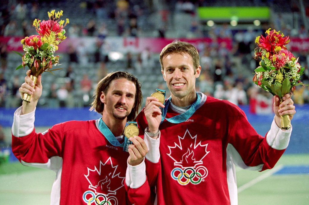 ATP players holding medals