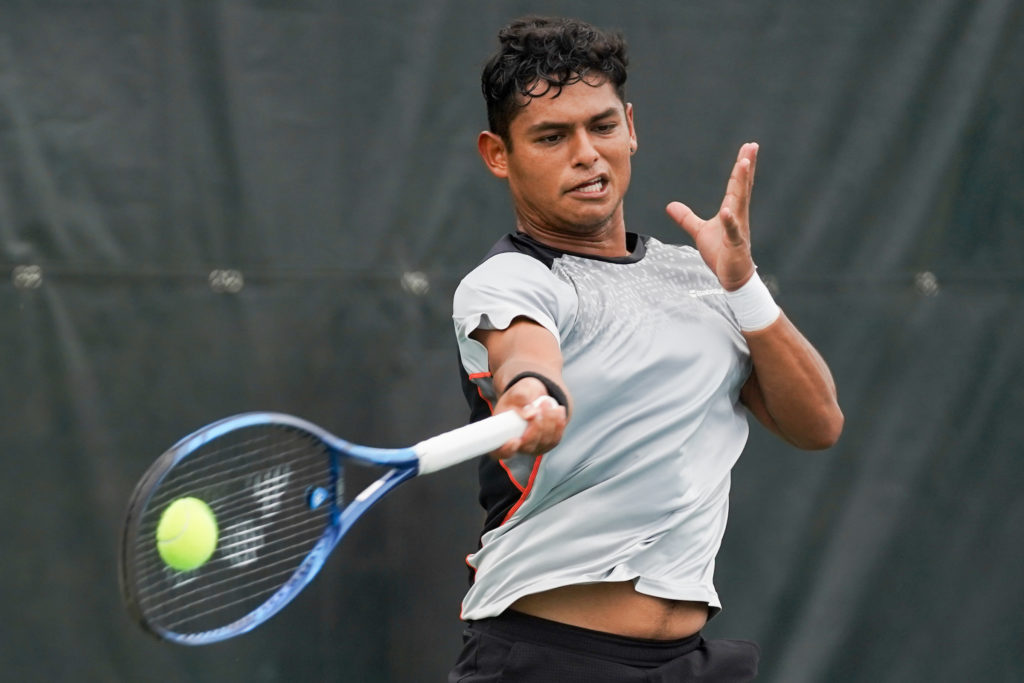 Juan Carlos Aguilar hits a forehand.