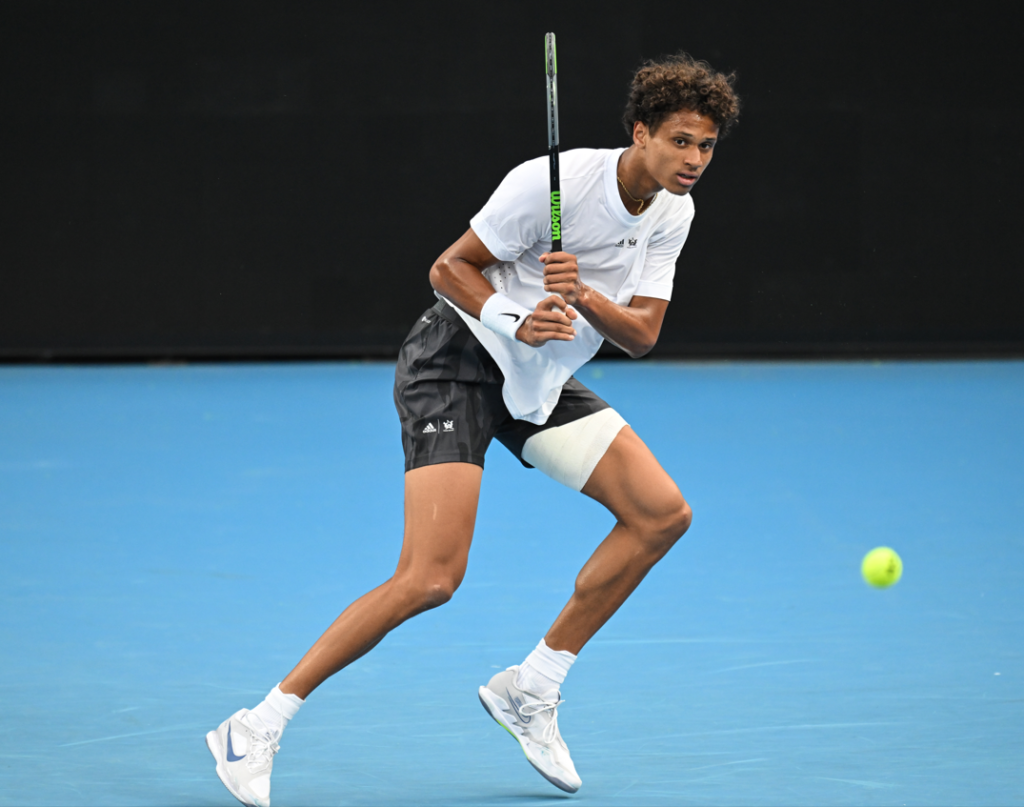 Gabriel Diall follows through on a backhand.