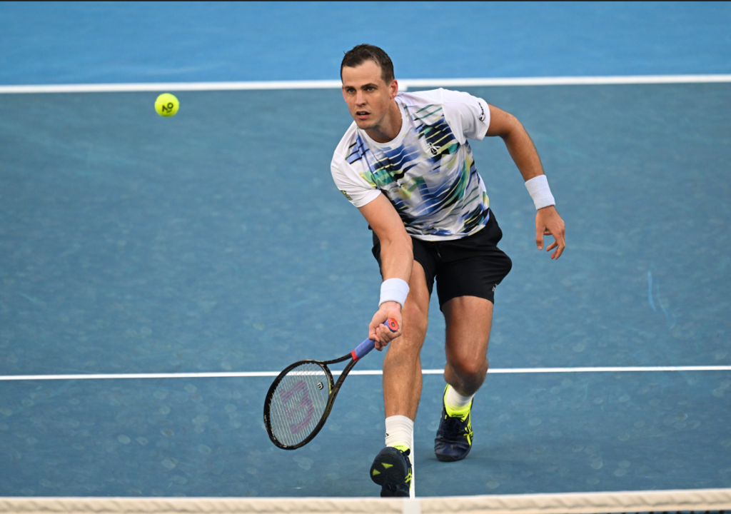Vasek Pospisil hits a forehand volley.