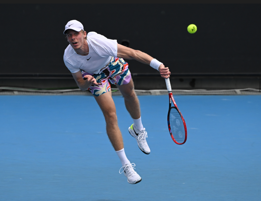 Denis Shapovalov follows through on a serve.